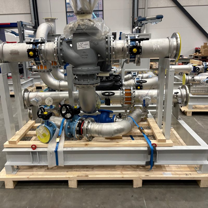 Piping skid with large three-way valve, butterfly valves and stainless steel pipework on a pallet