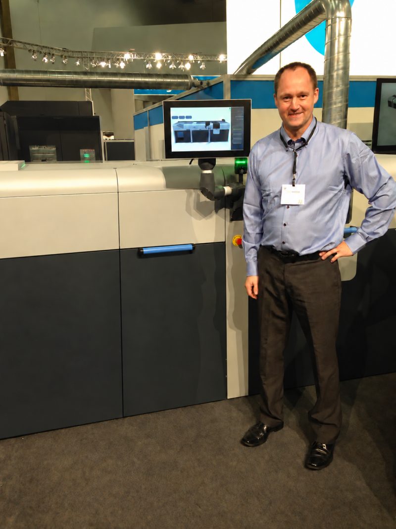 Mads Kylling with industrial printing and coating equipment